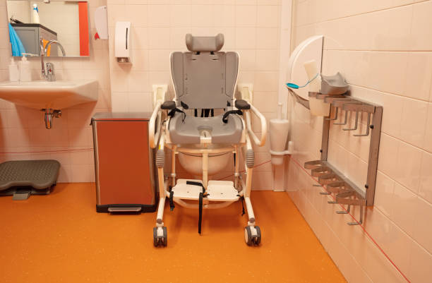 Child sitting conveniently in a pediatric bathtub chair with caregiver guide